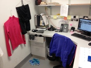 Employee drying their cycling attire in the office