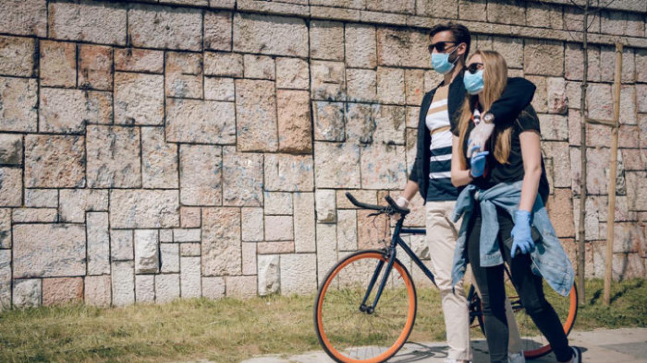 Couple walking with bike