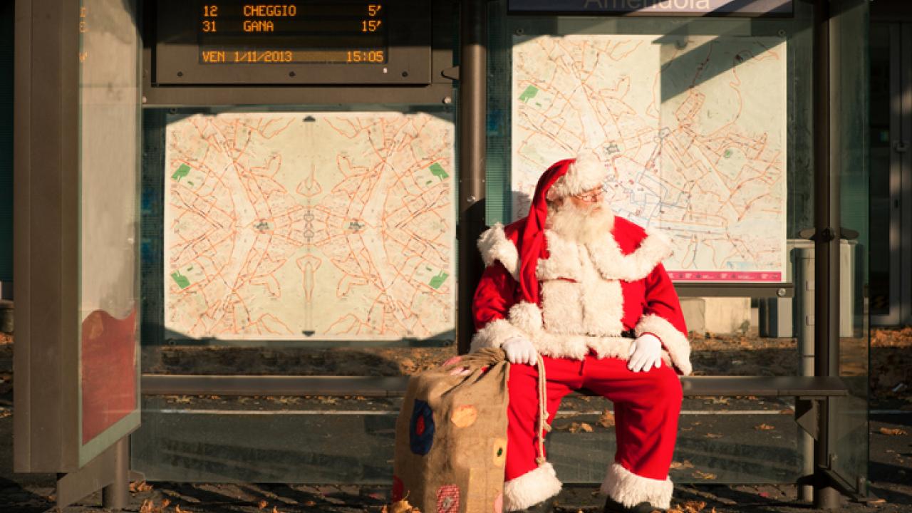 Santa Waiting at a Transit Stop